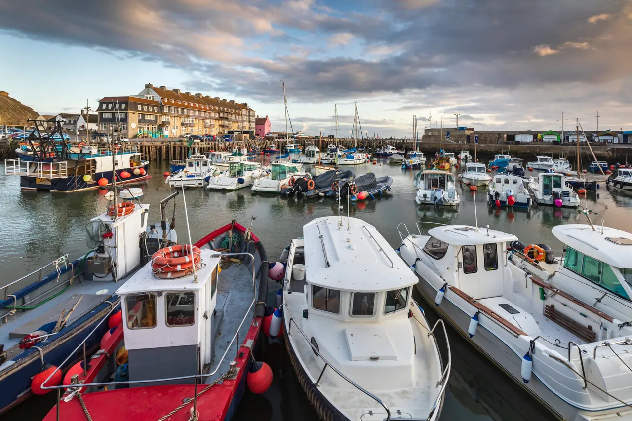 Fishing boats in West Bay harbour near Bridport, Dorset